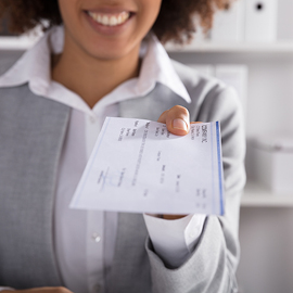 Woman holding a cashiers check